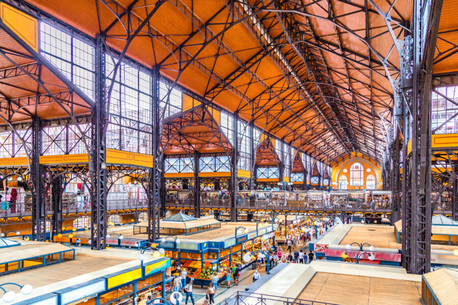 Interior view of Budapest's Central Market Hall, showcasing vibrant stalls and architectural details