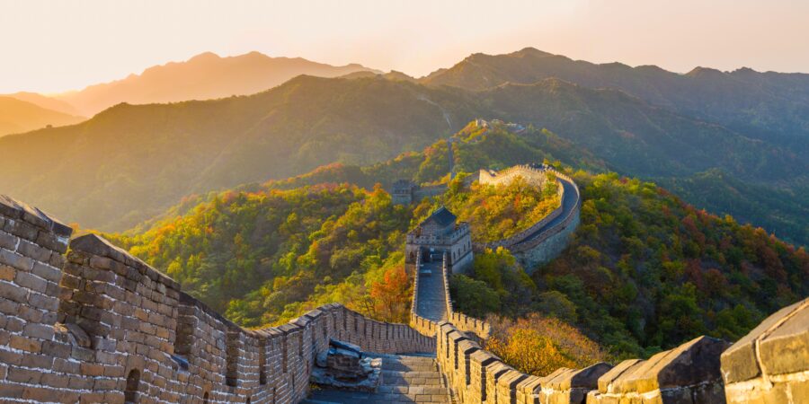 Great Wall of China at Mutianyu, Hebei, surrounded by mountains and forests, near Beijing.
