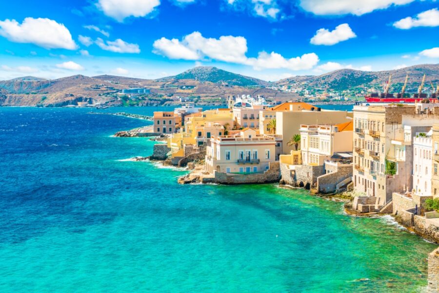 Vibrant view of Ermoupoli town on Syros Island, set against the Aegean Sea in Greece.