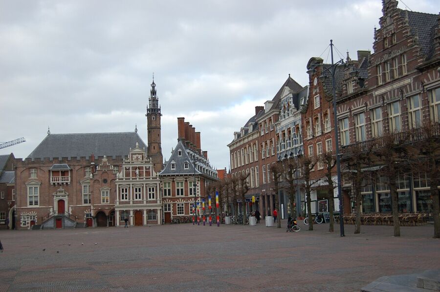The Grote Markt in Haarlem features a prominent brick building, reflecting the city's historical architectural style.