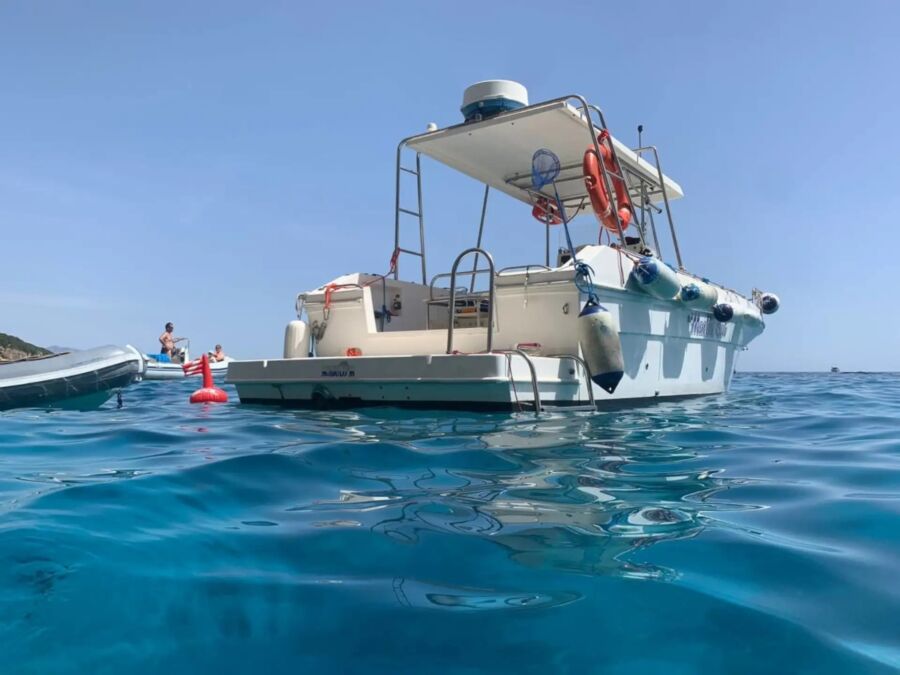 Speedboat cruising to Gulf of Orosei, featuring an aperitif, departing from Cala Gonone. Scenic coastal views included.