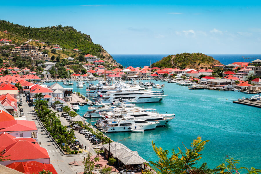 Elegant yachts moored in Gustavia, St Barts, reflecting the luxurious lifestyle of the Caribbean West Indies.