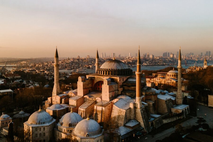 Aerial view of Hagia Sophia in Istanbul at sunset, showcasing historic architecture and cityscape.