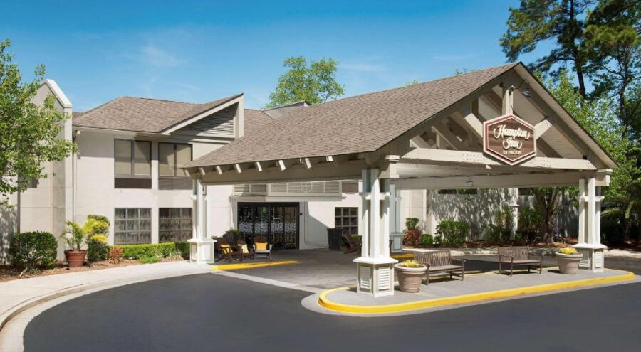 The Hampton Inn Hilton Head in Hilton Head entrance, showcasing a modern design with clear signage and an nviting entryway.
