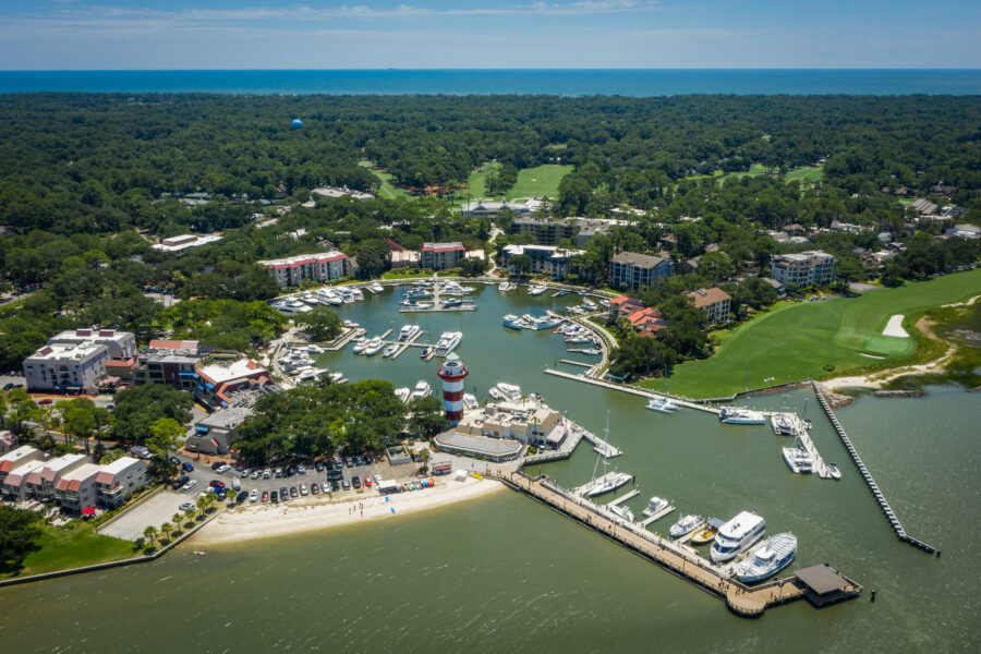 Aerial view of Harbour Town and its lighthouse on Hilton Head Island, featuring the vibrant harbor and surrounding area