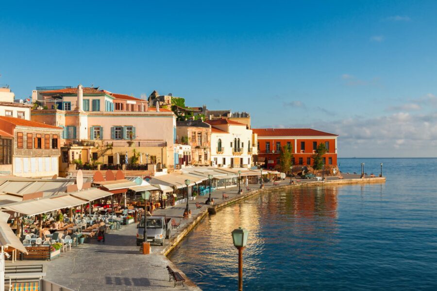 Charming Mediterranean waterfront town with vibrant architecture, cafés, and serene sea views.