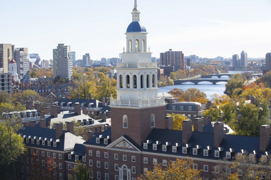 Aerial view of Harvards Lowell House, autumn foliage, Charles River. Iconic architecture and scenery.