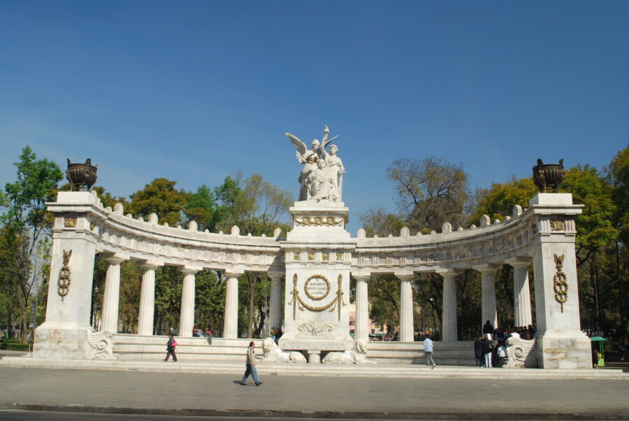 The Hemiciclo a Juárez, a circular monument in Mexico City, showcases a statue of Benito Juárez amid landscaped gardens