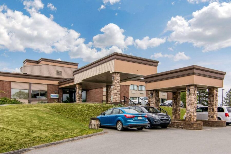 Front entrance of the Comfort Inn, HFX Airport Hotel in Halifax, Canada, featuring a welcoming facade and signage.