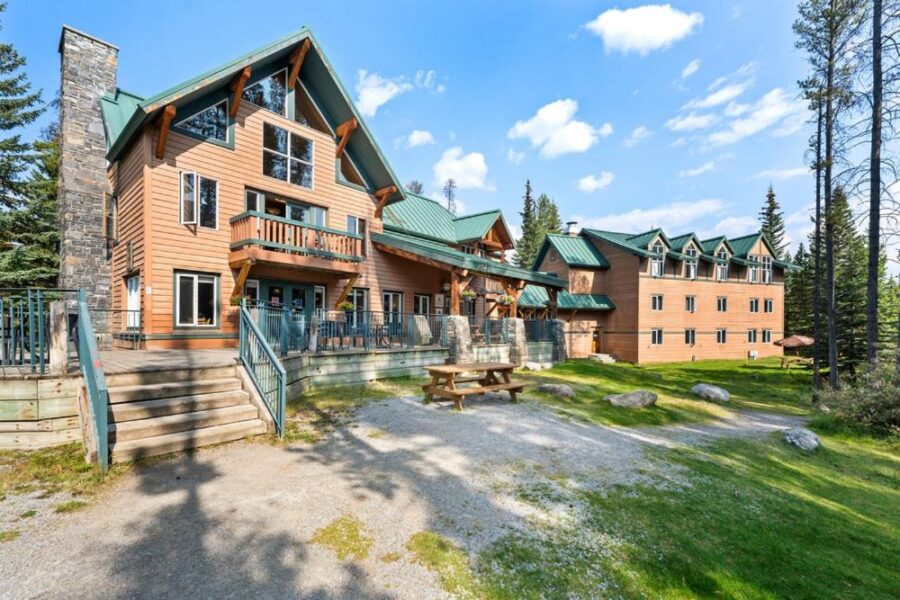 The lodge at HI Lake Louise Alpine Centre, surrounded by stunning mountain scenery in Banff National Park.