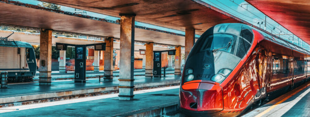 Sleek high-speed train stands at Firenze Santa Maria Novella station, showcasing modern rail travel in Italy.