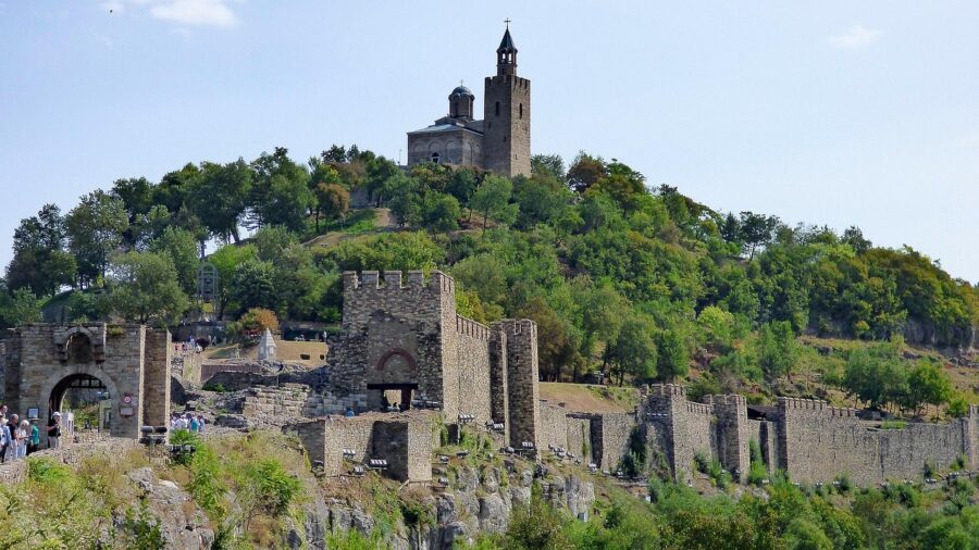 Medieval Tsarevets Fortress hilltop ruins with church and bell tower in Veliko Tarnovo, Bulgaria.