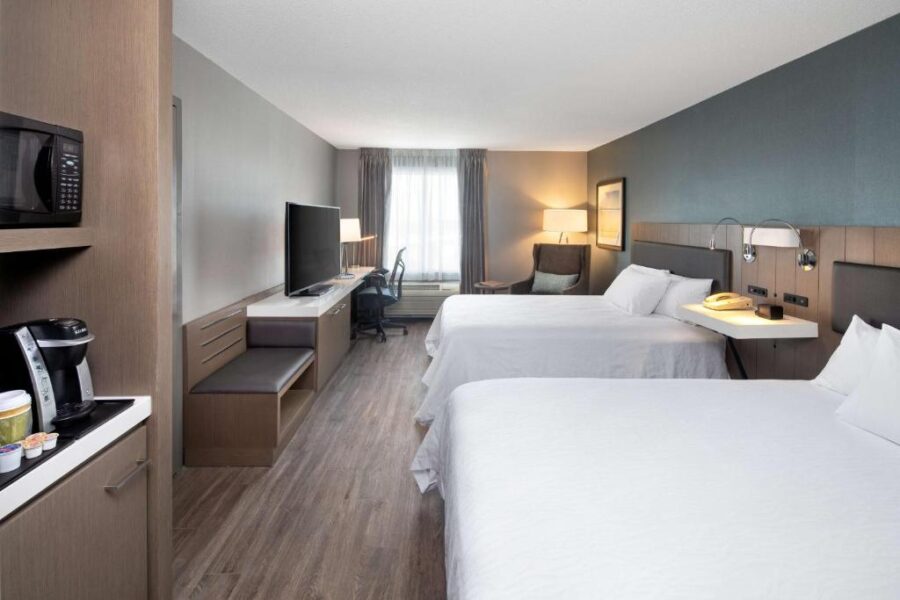 Interior of a Hilton Garden Inn hotel room with two beds and a TV, located in Halifax, Canada.