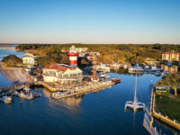 Aerial view of Harbour Town and its iconic lighthouse on Hilton Head Island, South Carolina, showcasing the coastal landscape.