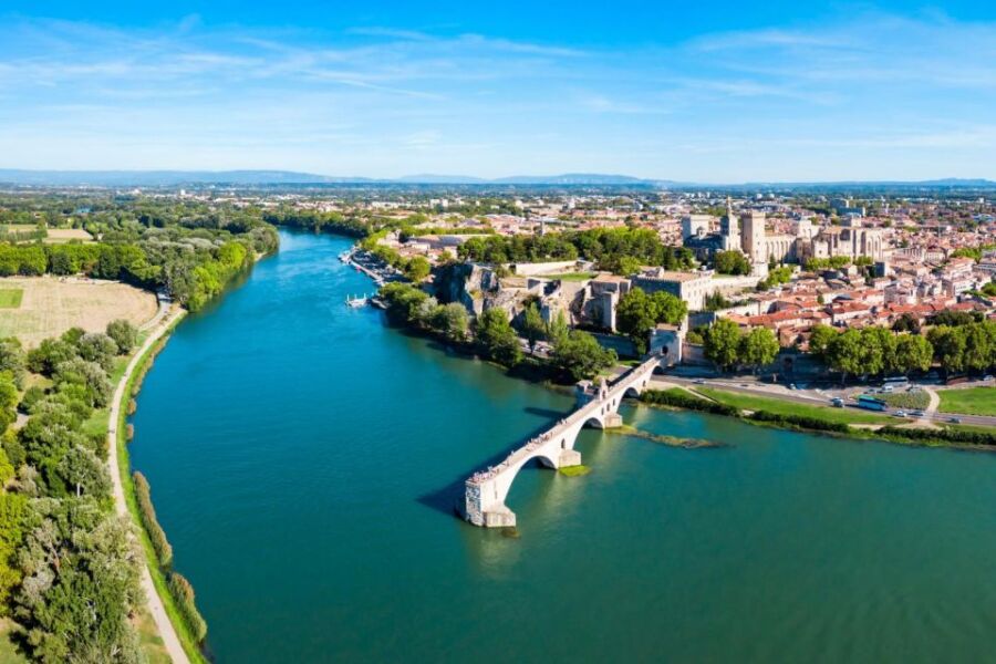 Ancient stone bridge over river in Avignon