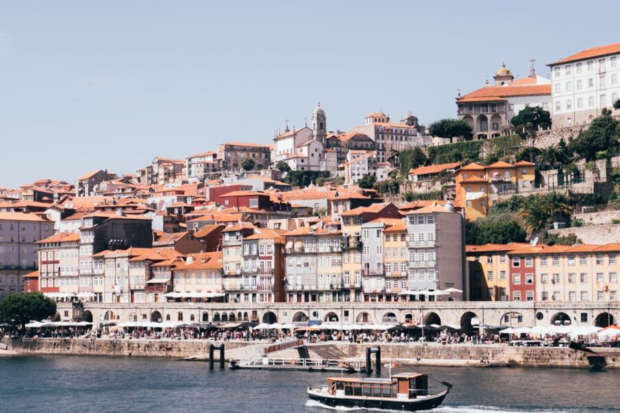 Picturesque Ribeira waterfront city with colorful buildings, historic charm, and lively atmosphere.