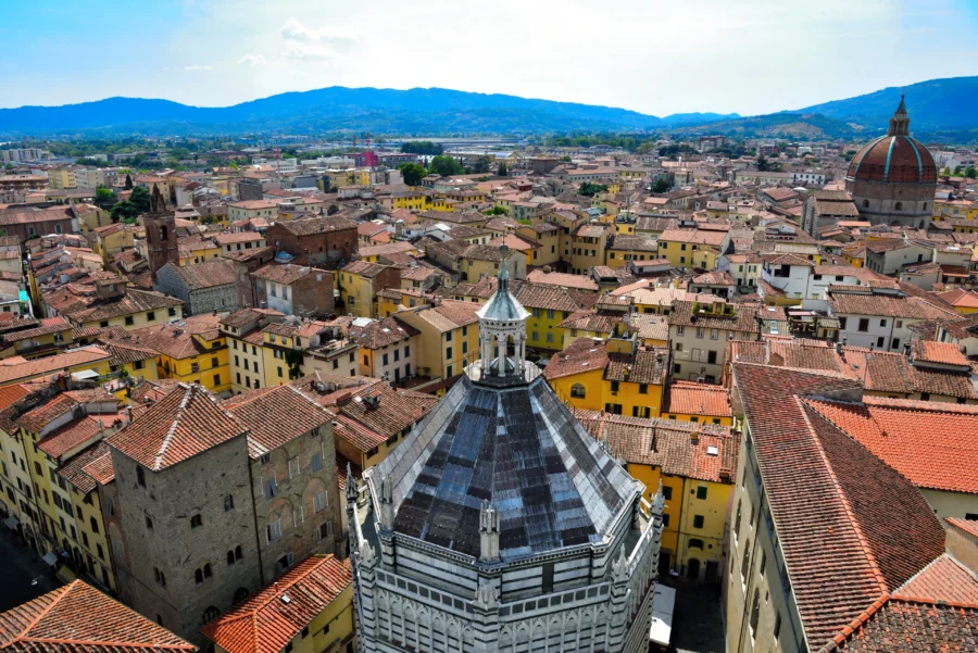Pistoia, Italy panoramic view of historic town with terracotta roofs, medieval towers, and church dome.