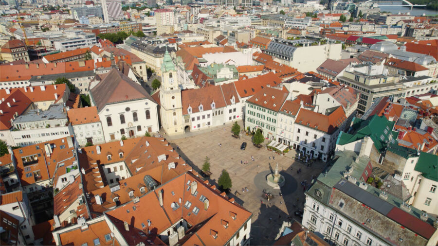 Aerial view of Bratislava's Hlavné Námestie square, showcasing historic buildings and red rooftops