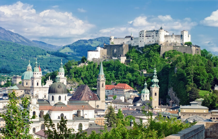 Panoramic view of Hohensalzburg Fortress overlooking Salzburg, Austria, showcasing its historic architecture and surrounding landscape