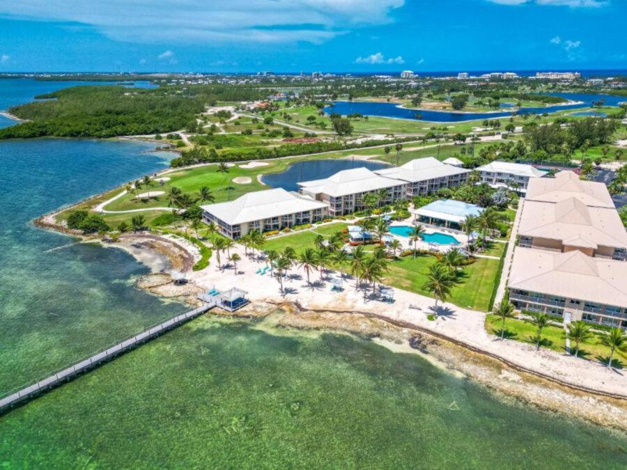Aerial view of the Holiday Inn Resort Grand Cayman, showcasing the architecture and beachfront location
