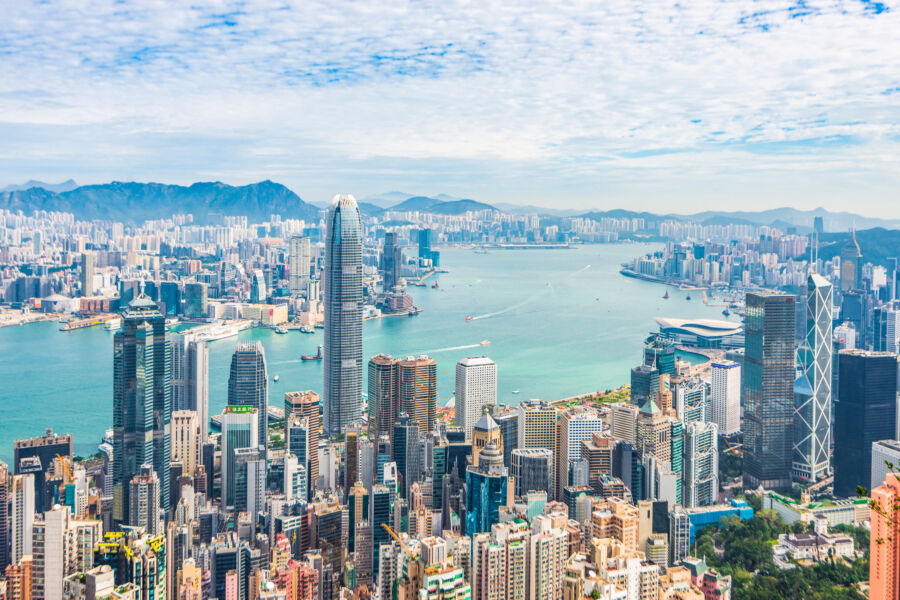 Panoramic view of Hong Kong's skyscrapers and Victoria Harbour from Victoria Peak, highlighting the vibrant cityscape