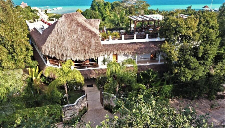 Ocean view from a thatched roof house at Hotel Aires Bacalar in Bacalar, Mexico.