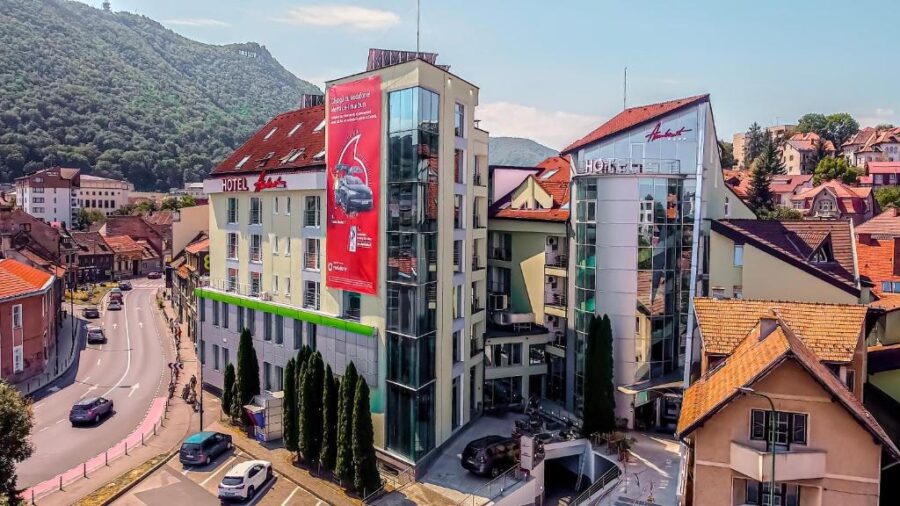 Hotel Ambient building exterior in Brasov, Romania, showcasing its architecture and surrounding environment.