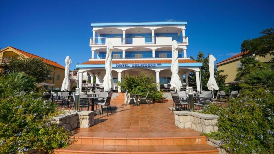 Hotel Belvedere building exterior in Sukošan, Croatia, showcasing modern architecture and surrounding landscape.