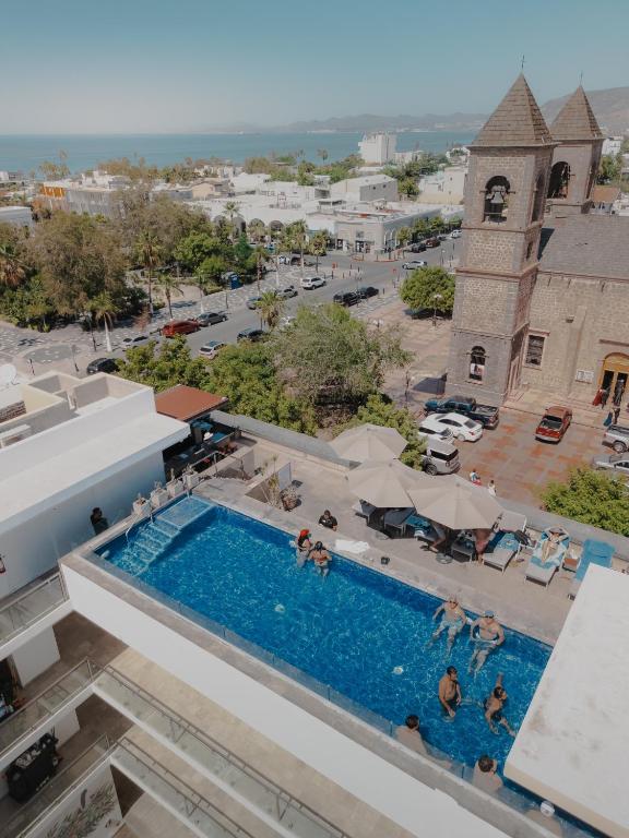 Rooftop view showcasing the pool and beach at Hotel Catedral La Paz, located in La Paz, Baja California Sur, Mexico.
