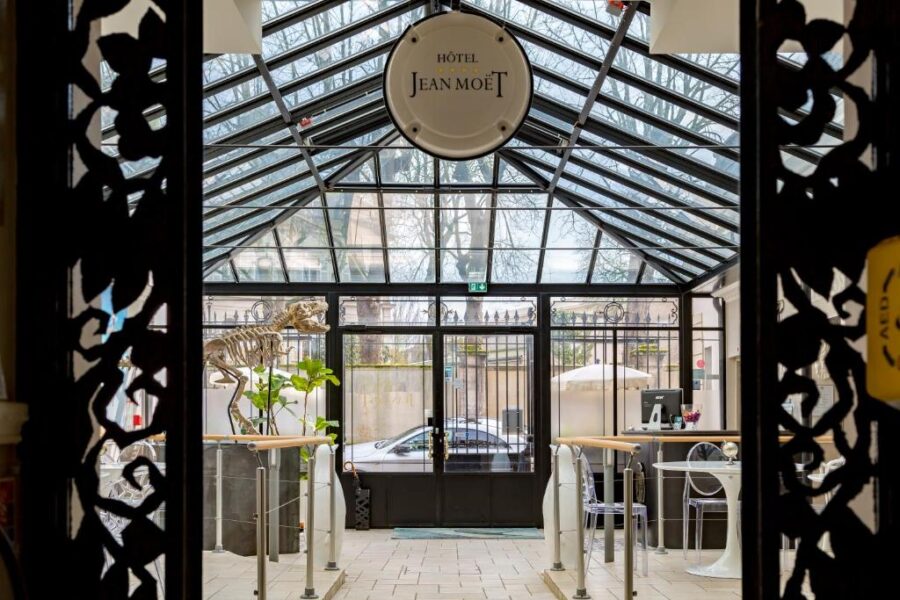 Hotel Jean Moet entrance conservatory with glass vaulted roof and skeleton display.