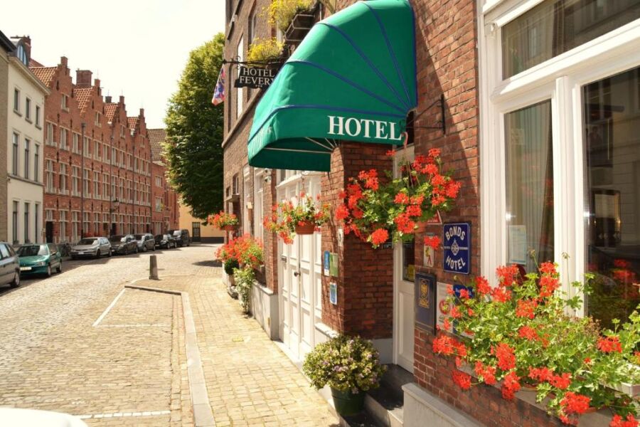 Front facade of Hotel Fevery in Belgium, featuring traditional design elements and a welcoming atmosphere.