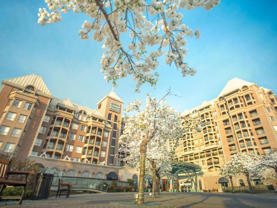The Hotel Grand Pacific Victoria, a prominent building in Victoria, Canada, featuring elegant design and inviting entrance.