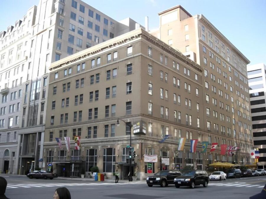 Hotel Harrington in Washington, DC, showcasing a large structure with many windows.
