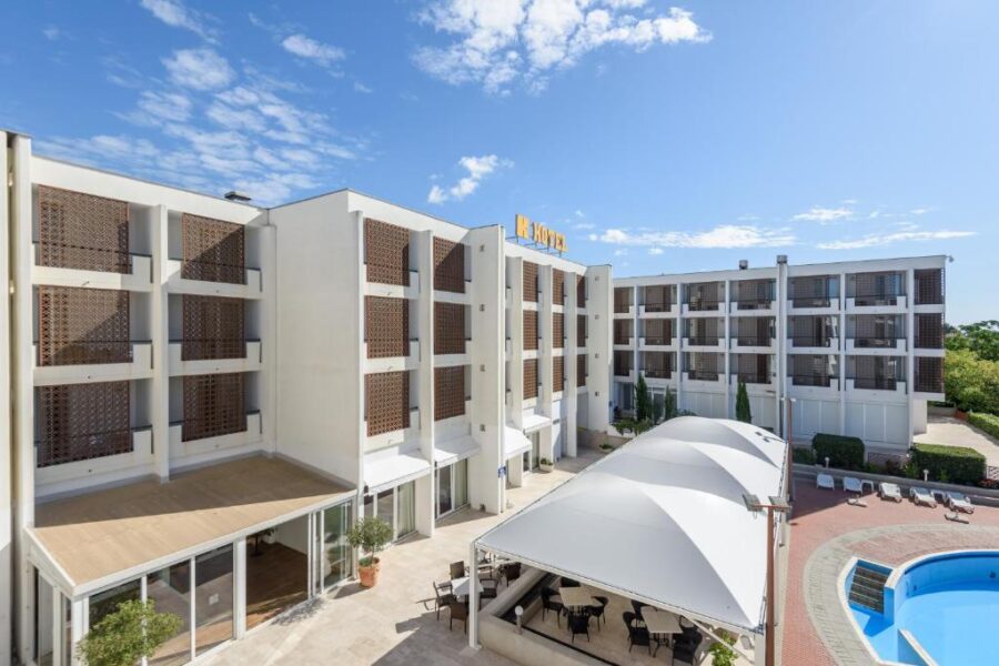 Hotel Kolovare situated centrally within a large resort in Zadar, Croatia, surrounded by lush greenery and amenities.