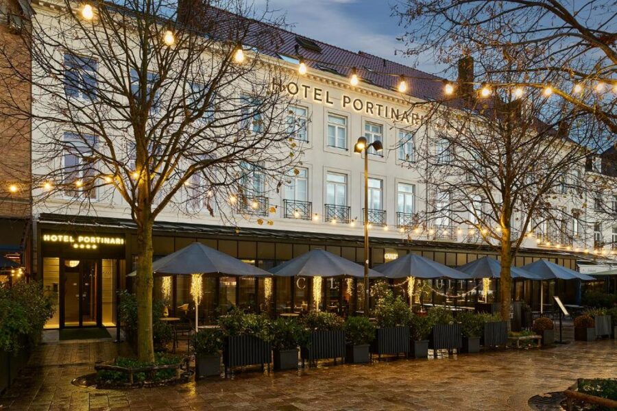 Exterior view of Hotel Portinari in Bruges, featuring modern architecture and inviting atmosphere.