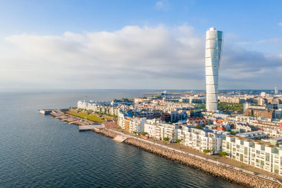 Malmö skyline with Turning Torso and waterfront harbor along Oresund in Sweden.