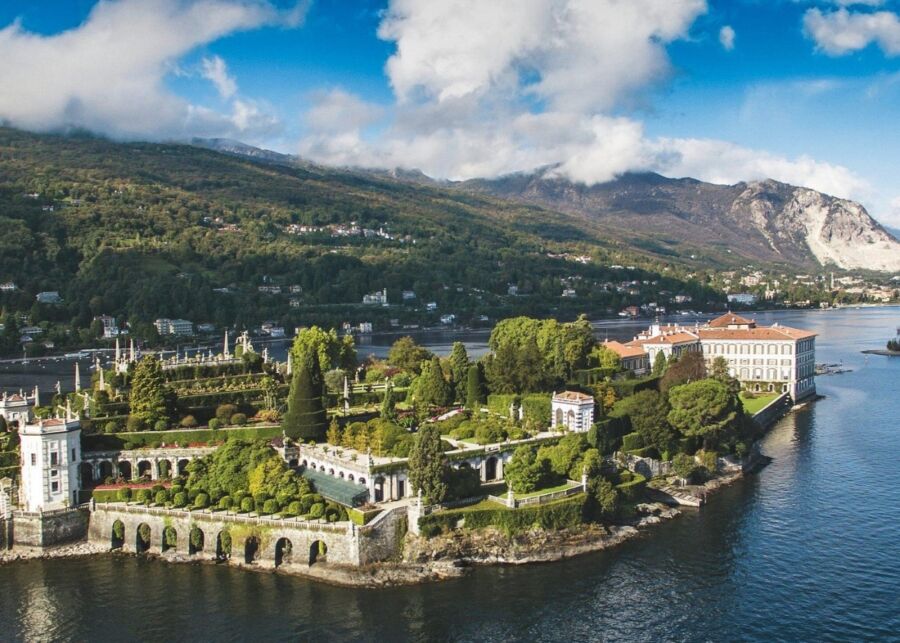 Scenic view of Isola Bella, Lake Como, showcasing lush gardens and historic architecture from the Hop-On Hop-Off boat tour.
