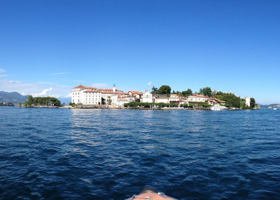 Tranquil lake seen from a boat, part of the Isola Bella Hop-On Hop-Off Boat Tour experience.