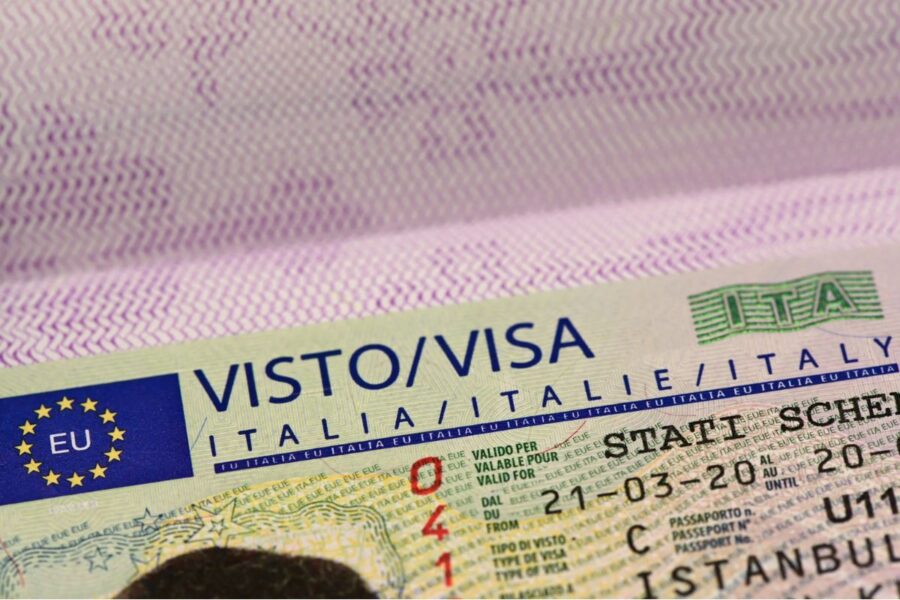 Close-up of Italian visa document featuring EU emblem and travel authorization details.