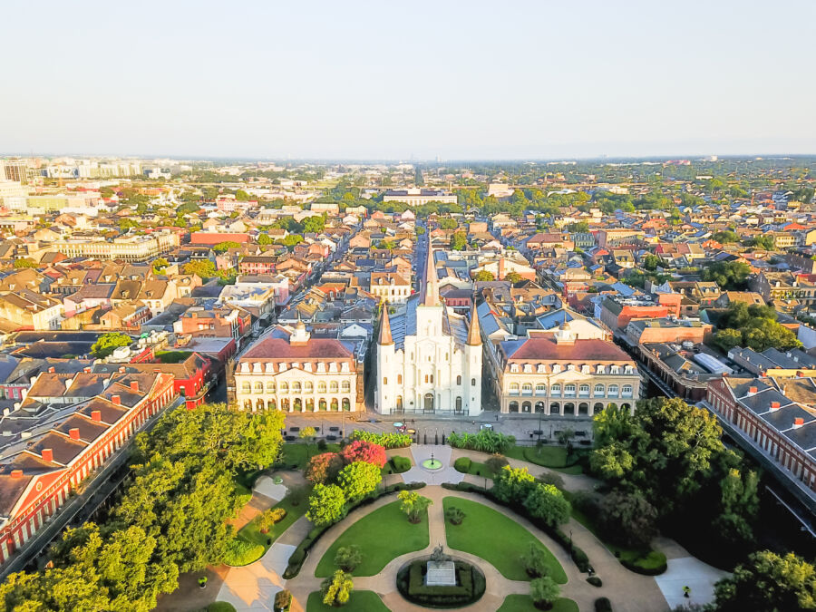Aerial view of Jackson Square in New Orleans, featuring Saint Louis Cathedral and historic buildings in the French Quarter