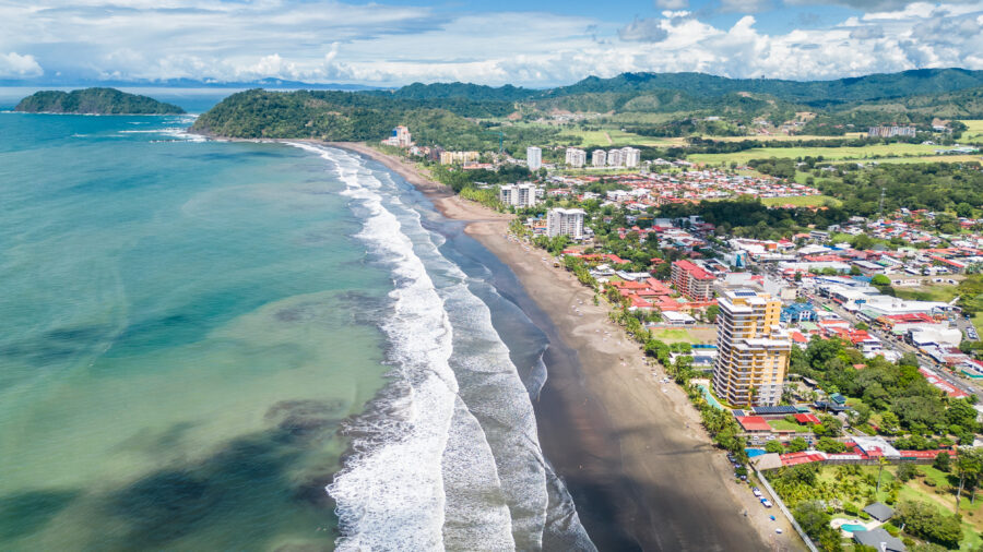Aerial view of Jaco beach town in Puntarenas, Costa Rica, showcasing sandy beaches and vibrant coastal buildings