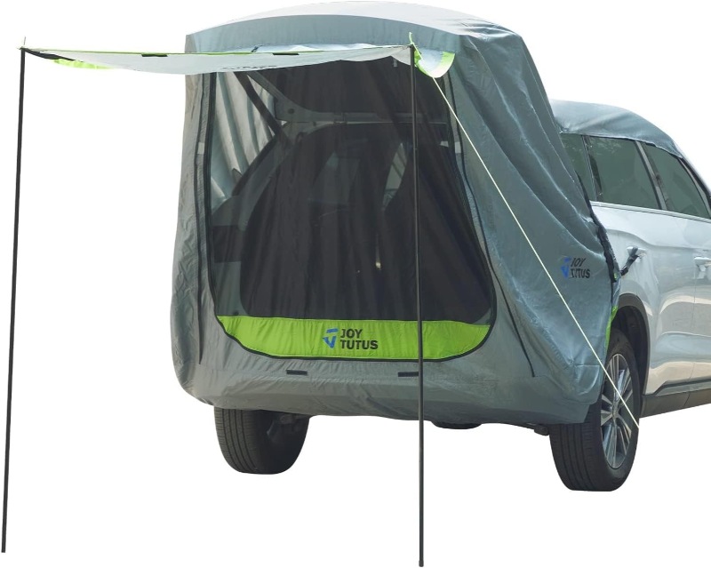 Car equipped with a JOYTUTUS SUV tailgate tent, showcasing a camping setup for outdoor adventures.
