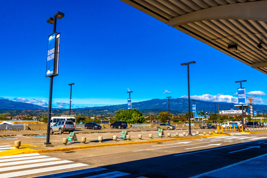 Outdoor view of Juan Santamaria International Airport in San Jose, Alajuela, Costa Rica, featuring terminal and surrounding area