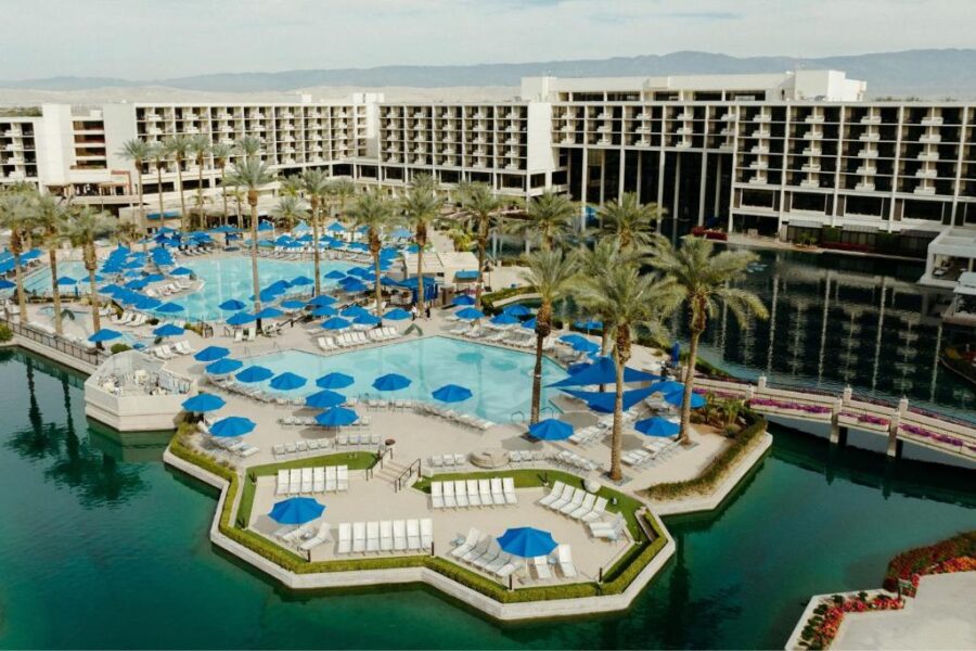 Relaxing pool area at JW Marriott Desert Springs Resort & Spa, showcasing a clear pool and inviting lounge chairs.