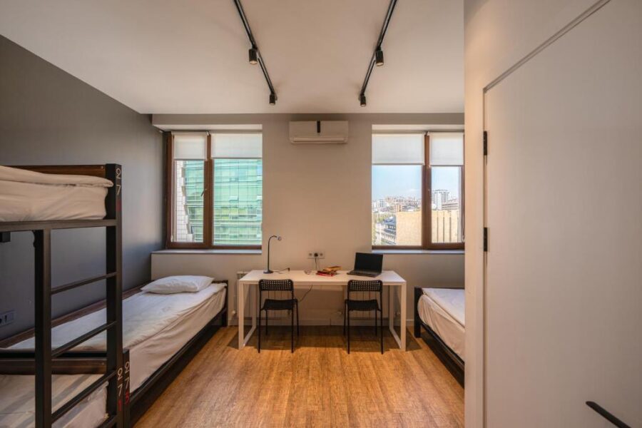 Interior of Kantar Hostel in Yerevan, Armenia, showcasing a bunk bed room with two beds and storage lockers.