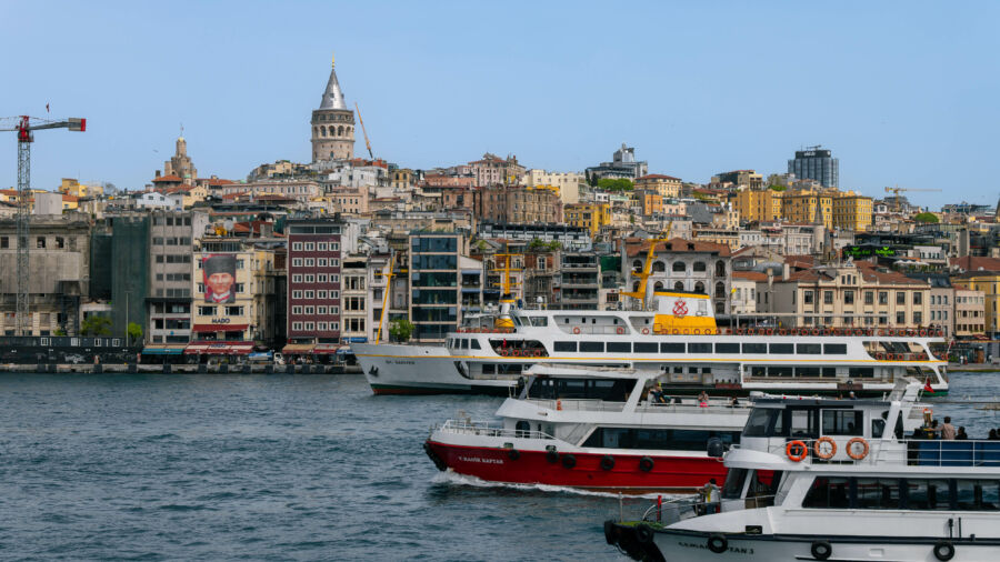 Scenic view of Karakoy with Galata Tower and various boats and ferries navigating the Bosphorus