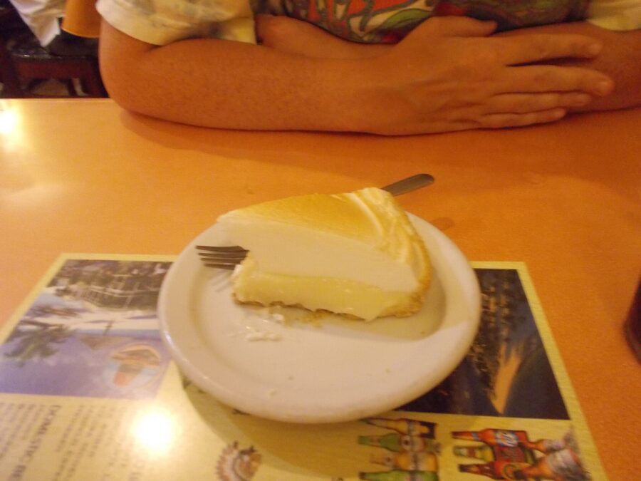 Slice of key lime cheesecake on a plate, presented at El Siboney Restaurant in Key West, Florida.