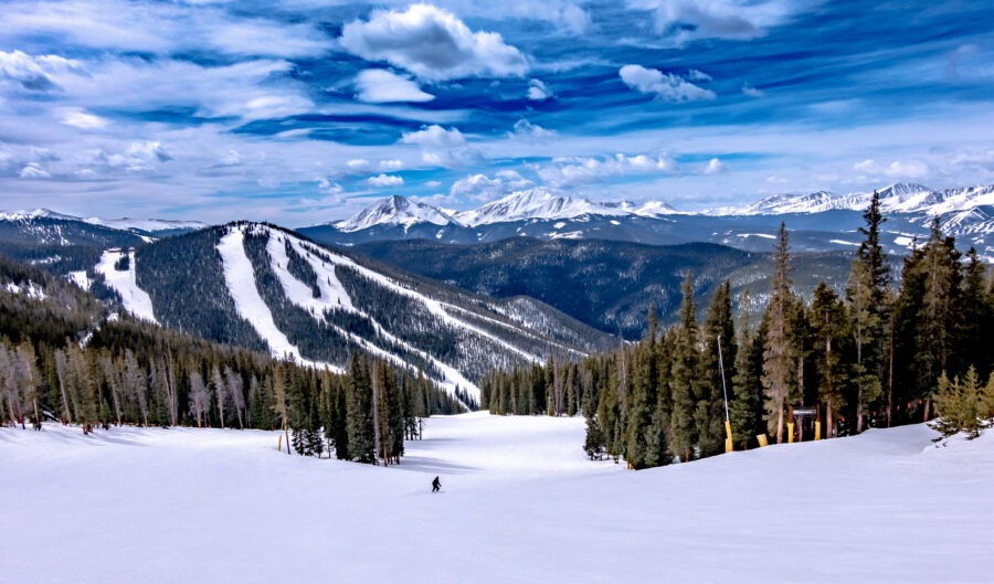 Panoramic view of Keystone Ski Resort town in Colorado's Rocky Mountains, snow-capped mountains and ski slopes