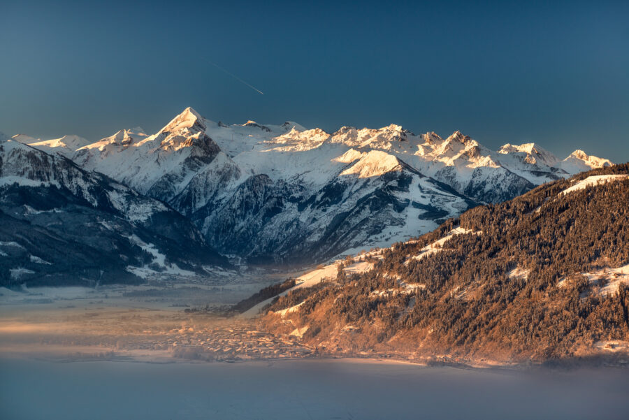 Scenic view of Kitzsteinhorn mountain in Zell am See Kaprun, showcasing snow-capped peaks and clear blue skies