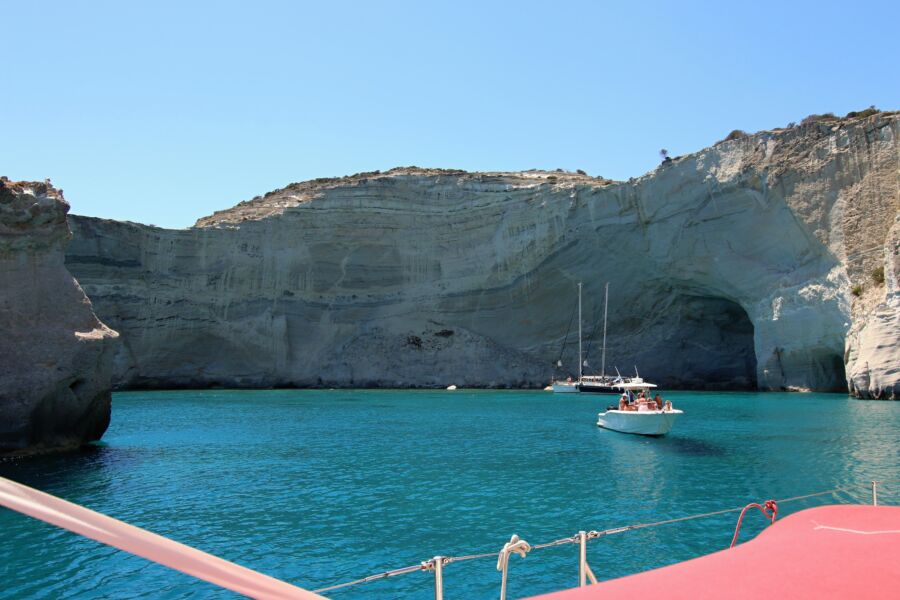 Kleftiko on Milos Island, Greece, showcasing dramatic cliffs and crystal-clear waters, perfect for swimming and exploration.